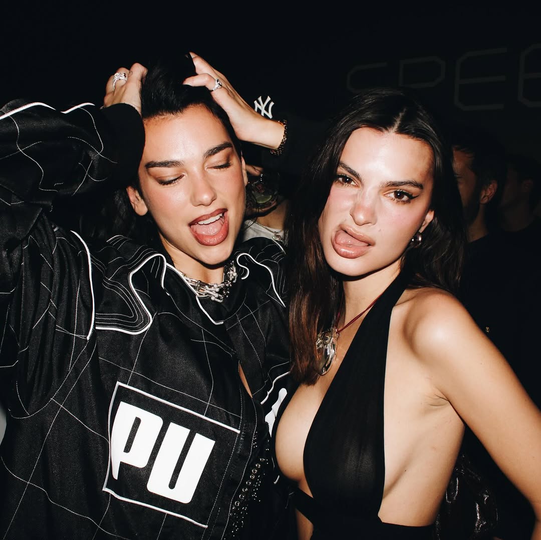 Dua Lipa and Emily Ratajkowski goof around at a Puma event in Milan, Italy.