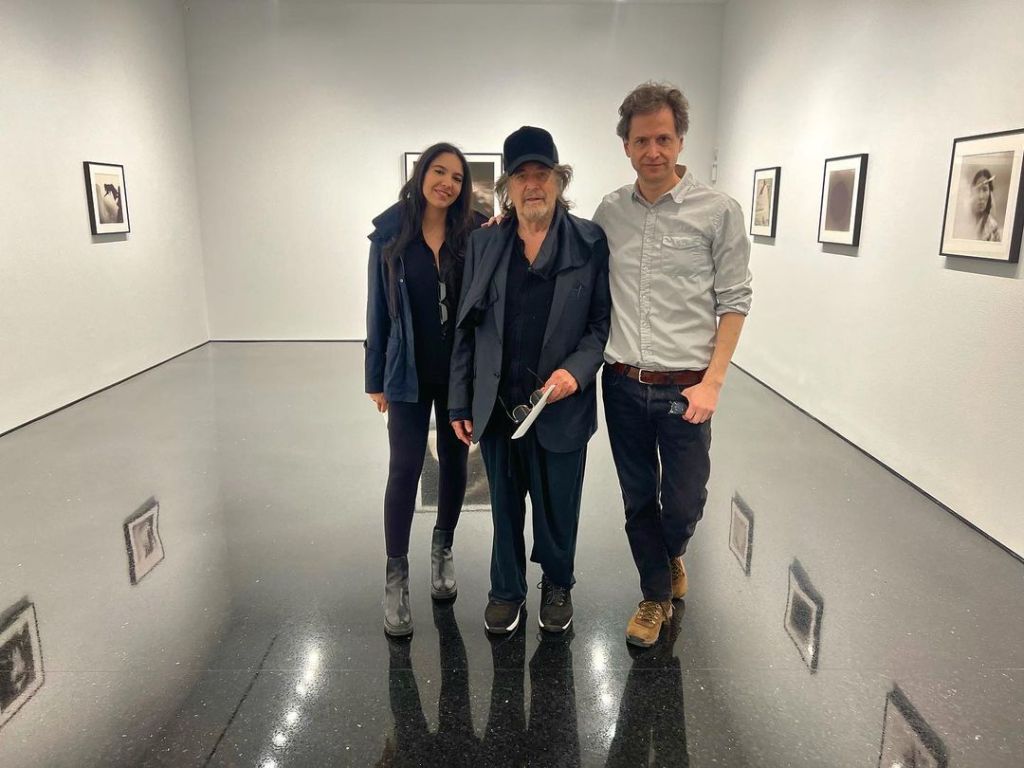 Noor Alfallah and Noor Pacino pose at an art gallery.