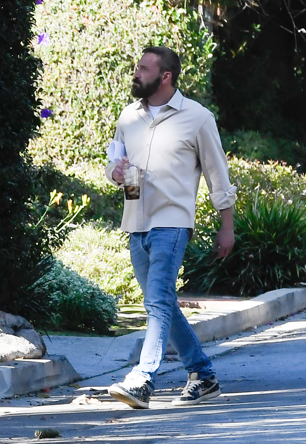 Ben Affleck walking to Jennifer Garner's house in Brentwood, Calif., on Thanksgiving in November 2024