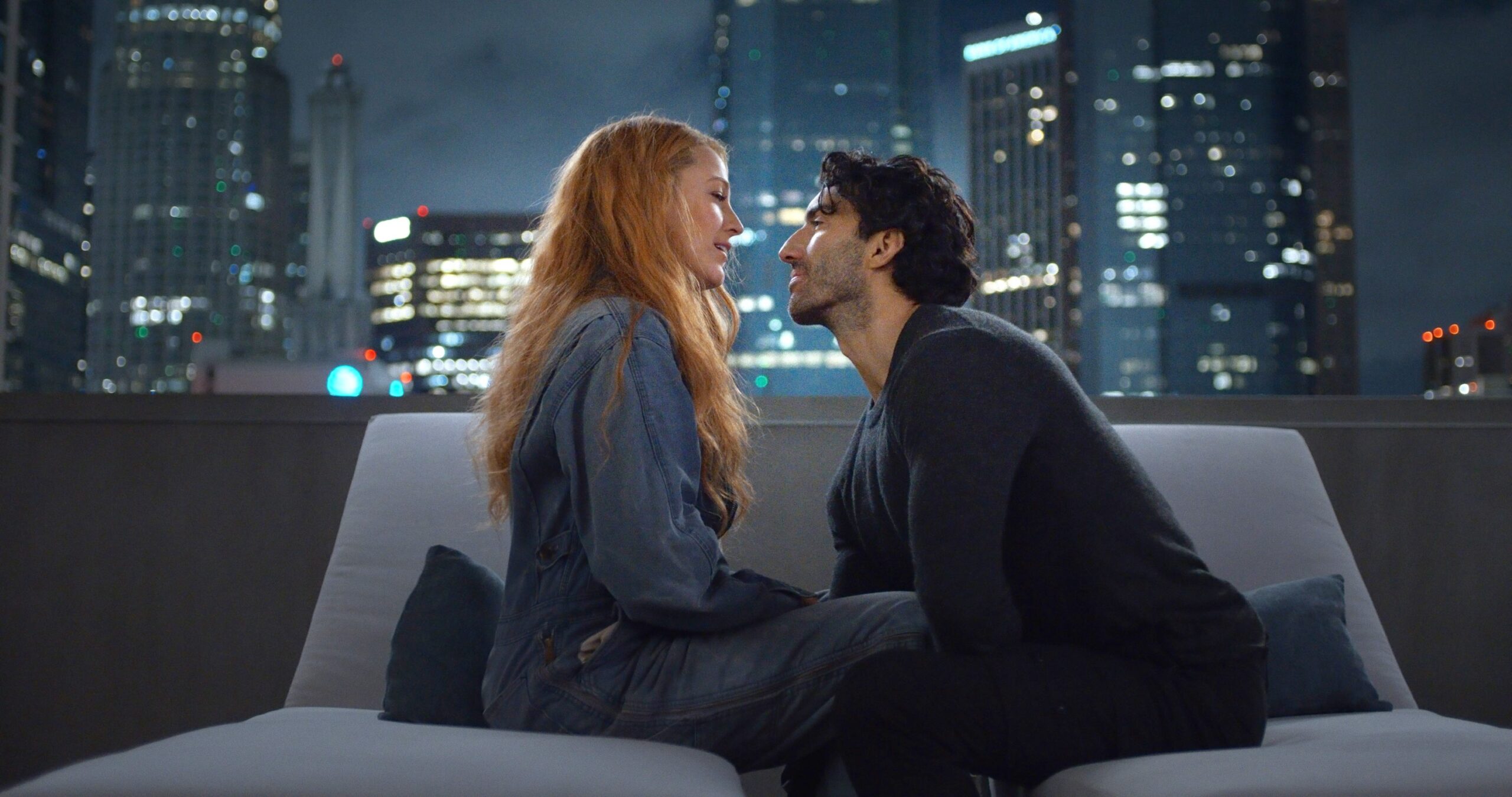 Blake Lively and Justin Baldoni sitting and talking in "It Ends With Us"