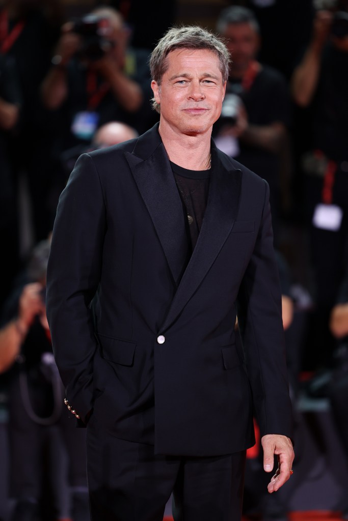 Pitt at the Venice Film Festival in a black suit.