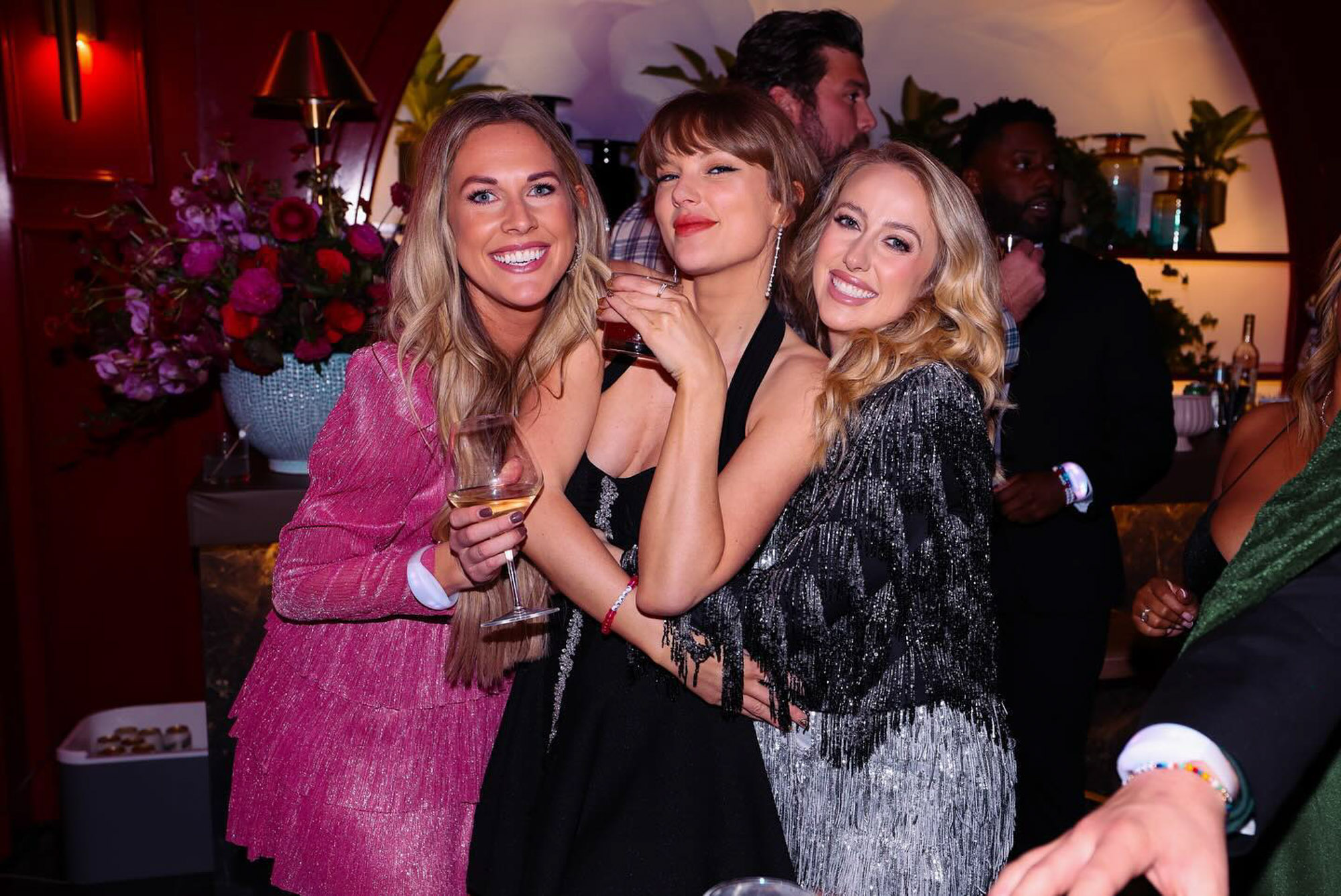 Taylor Swift, Brittany Mahomes and another woman at the Eras Tour wrap party.