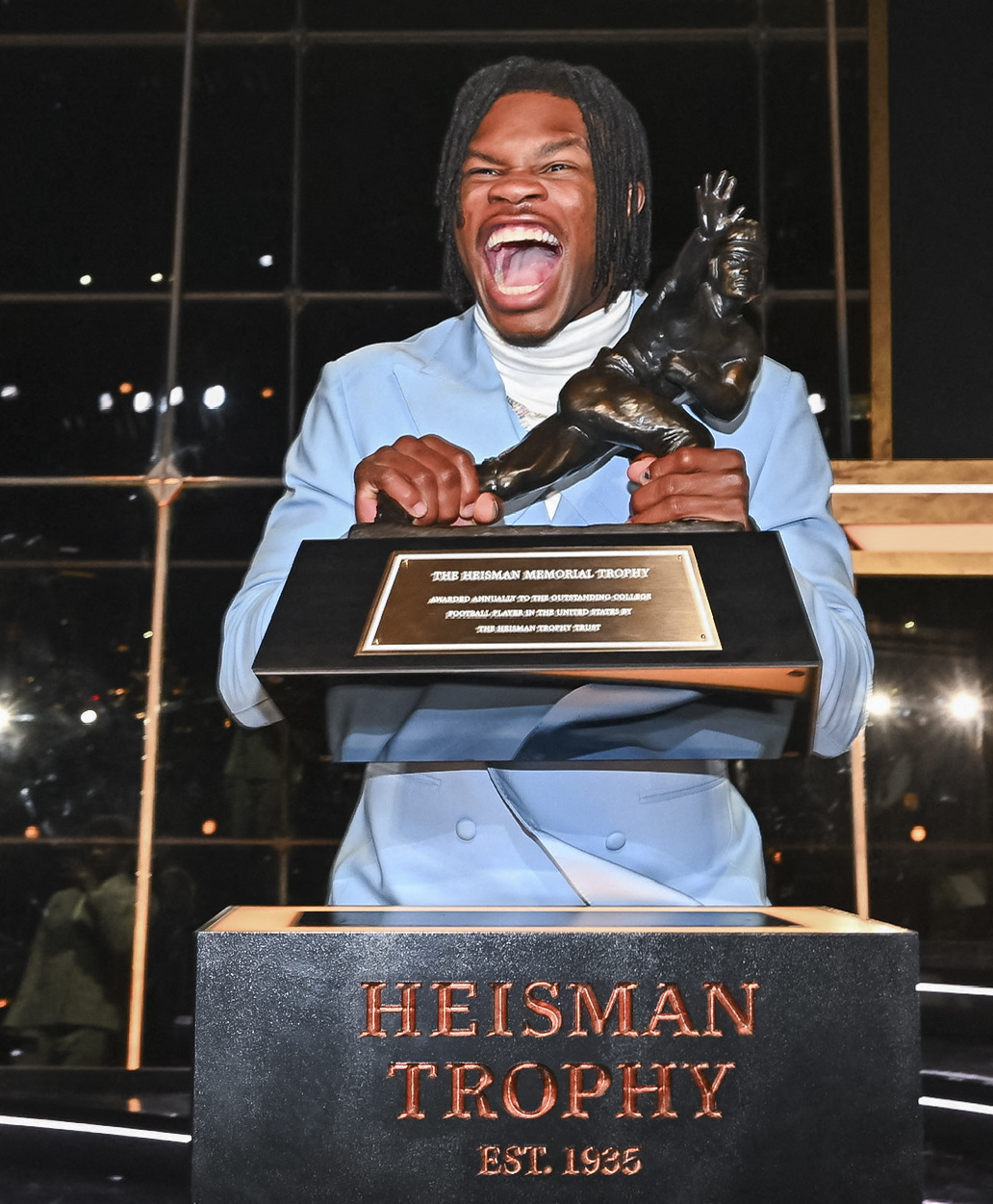 Travis Hunter with his Heisman Trophy.