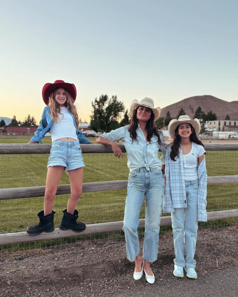 Emma Heming posing with her daughters.