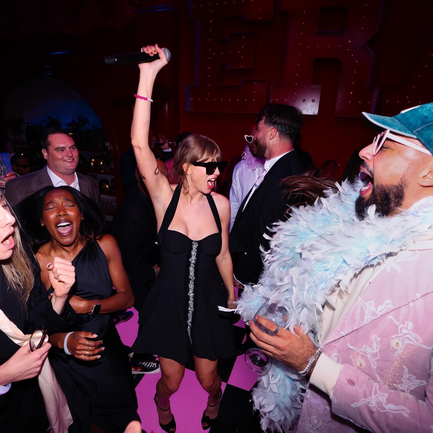 Travis Kelce, Taylor Swift and Ross Travis at the Eras tour wrap party.