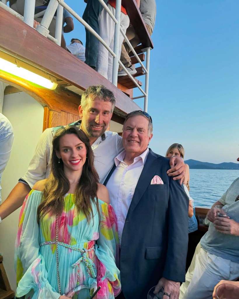 Bill Belichick and Jordon Hudson on a boat with a friend.