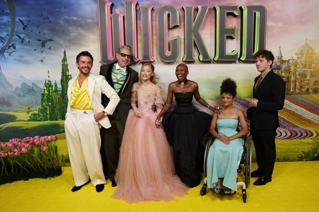 Ariana Grande and Ethan Slater with their "Wicked" cast mates in November.