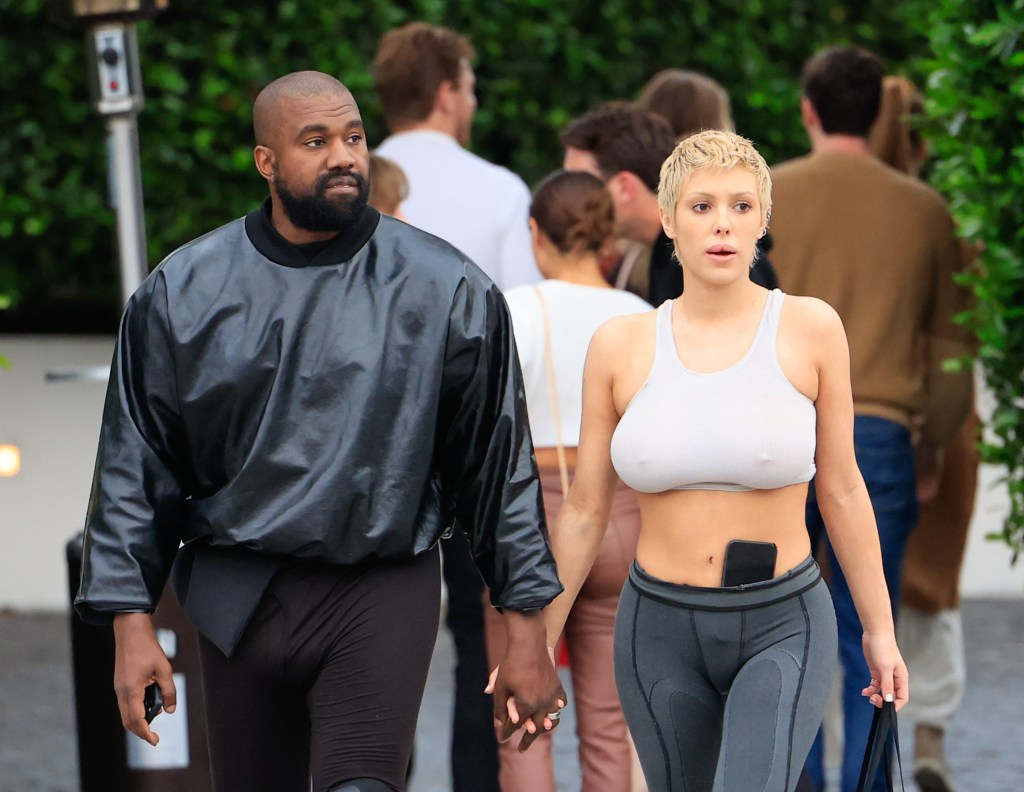 Bianca Censori and Kanye West holding hands