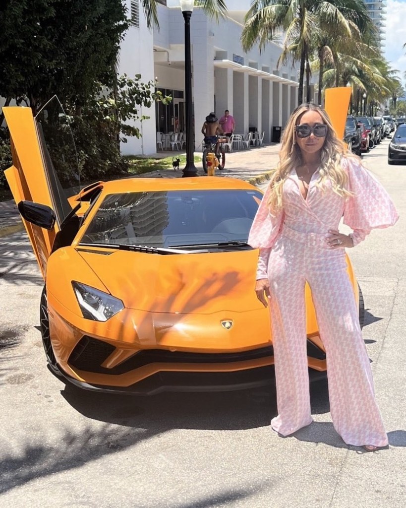 Karen Huger with a Lamborghini