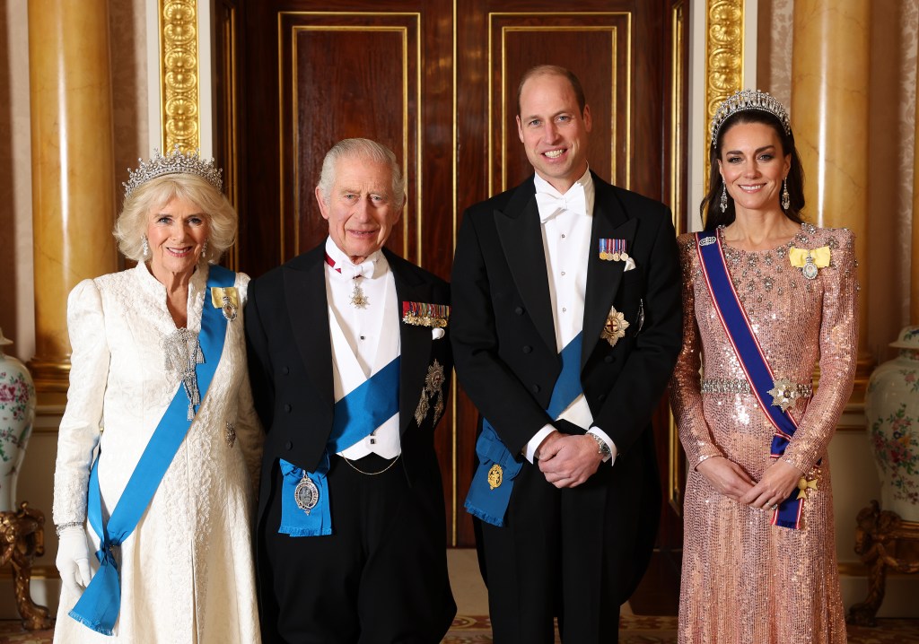 Queen Camilla, King Charles III, Prince William, Prince of Wales and Catherine, Princess of Wales pose for a photograph ahead of The Diplomatic Reception in the 1844 Room at Buckingham Palace on Dec. 05, 2023 in London.