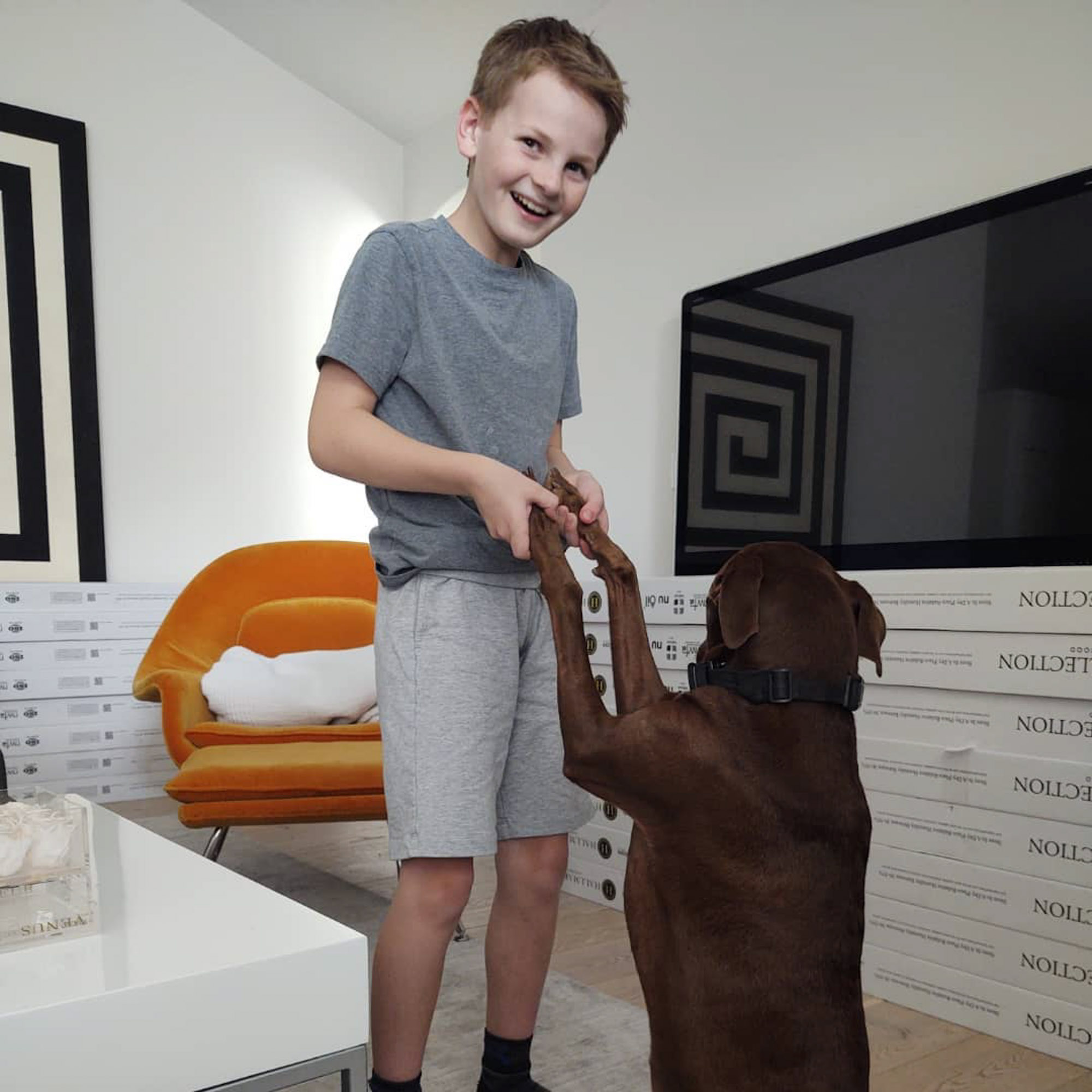 Henry Barlow playing with a dog