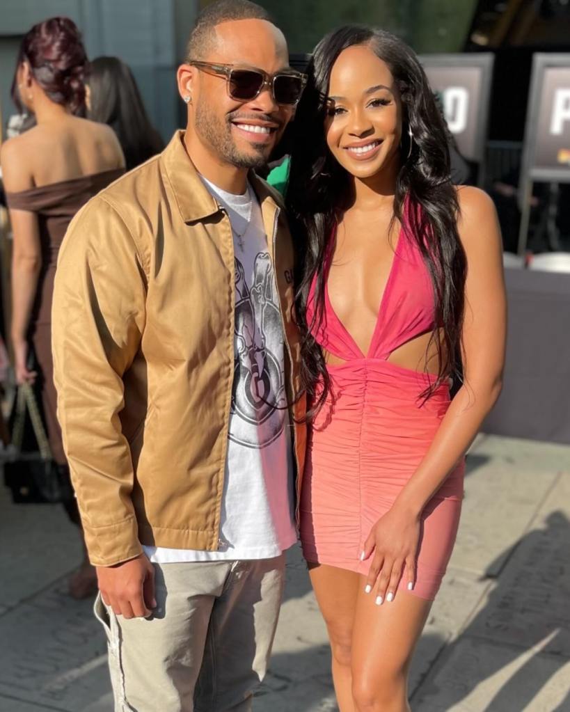 Martin Lawrence's daughter Jasmin and Eddie Murphy's son Eric posing together.