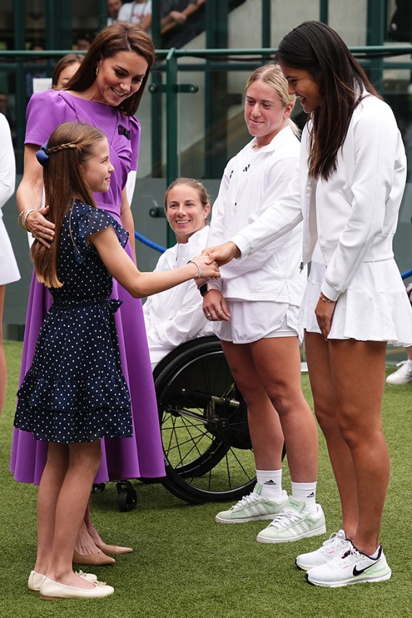 LONDON, ENGLAND - JULY 14: Catherine, Princess of Wales and Princess Charlotte meet Emma Raducanu (R) during a visit to the All England Lawn Tennis and Croquet Club in Wimbledon, south west London, on day fourteen of the Wimbledon Tennis Championships on July 14, 2024 in London, England. The Princess of Wales will present the trophy to the winner of the men's final. (Photo by Aaron Chown - WPA Pool/Getty Images)