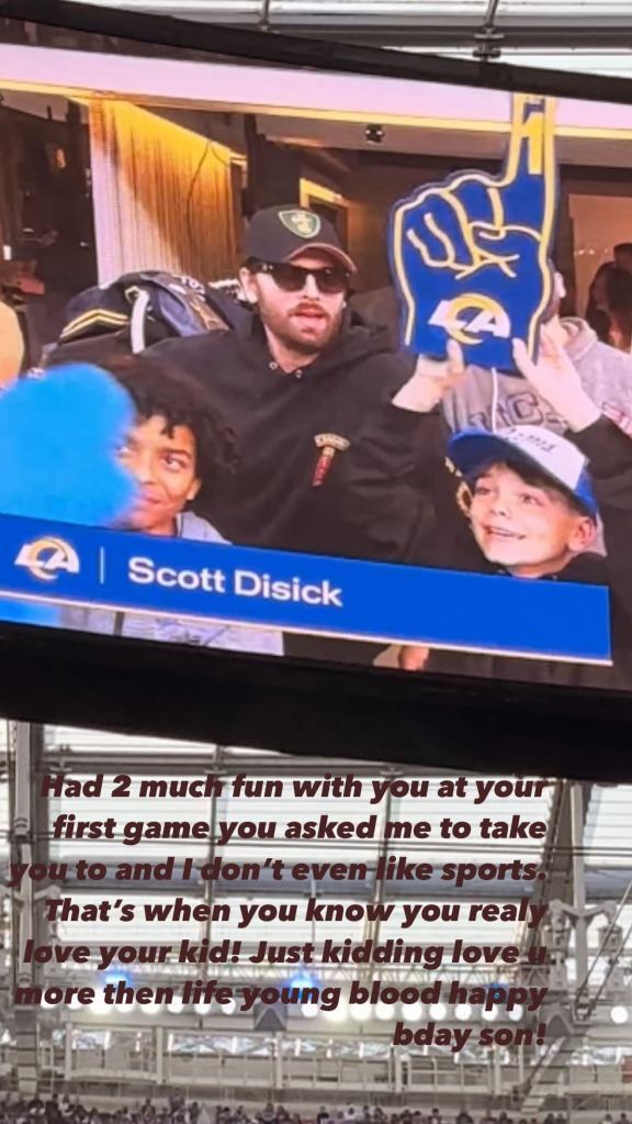 Scott Disick with his son Reign at a sporting game.