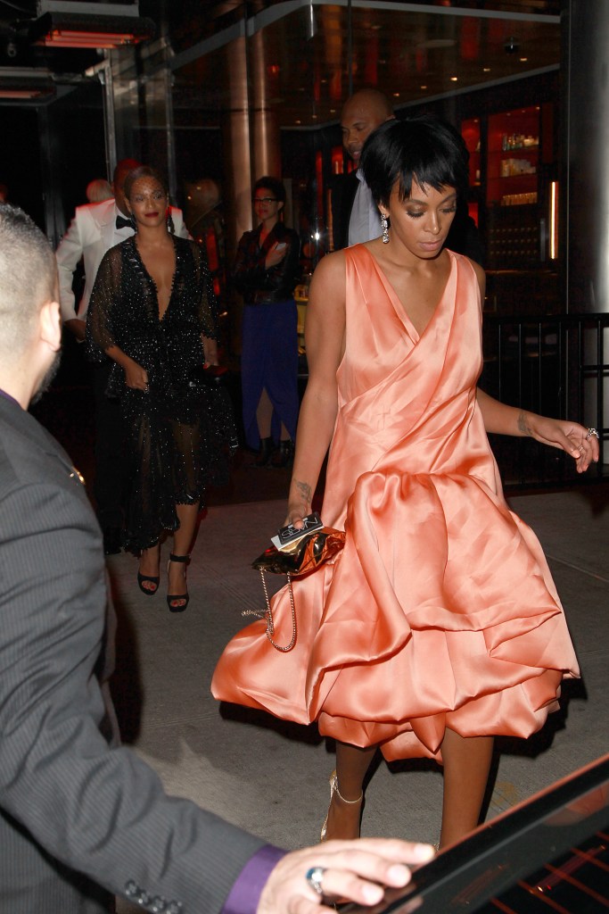 Solange walks in front of sister Beyonce and Jay-Z after having a fight with Jay-Z inside of the elevator.