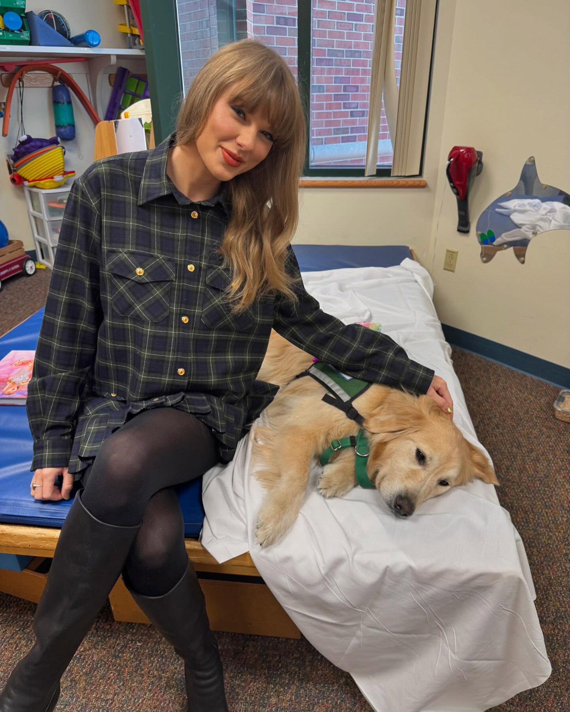 Taylor Swift with a dog at a hospital.