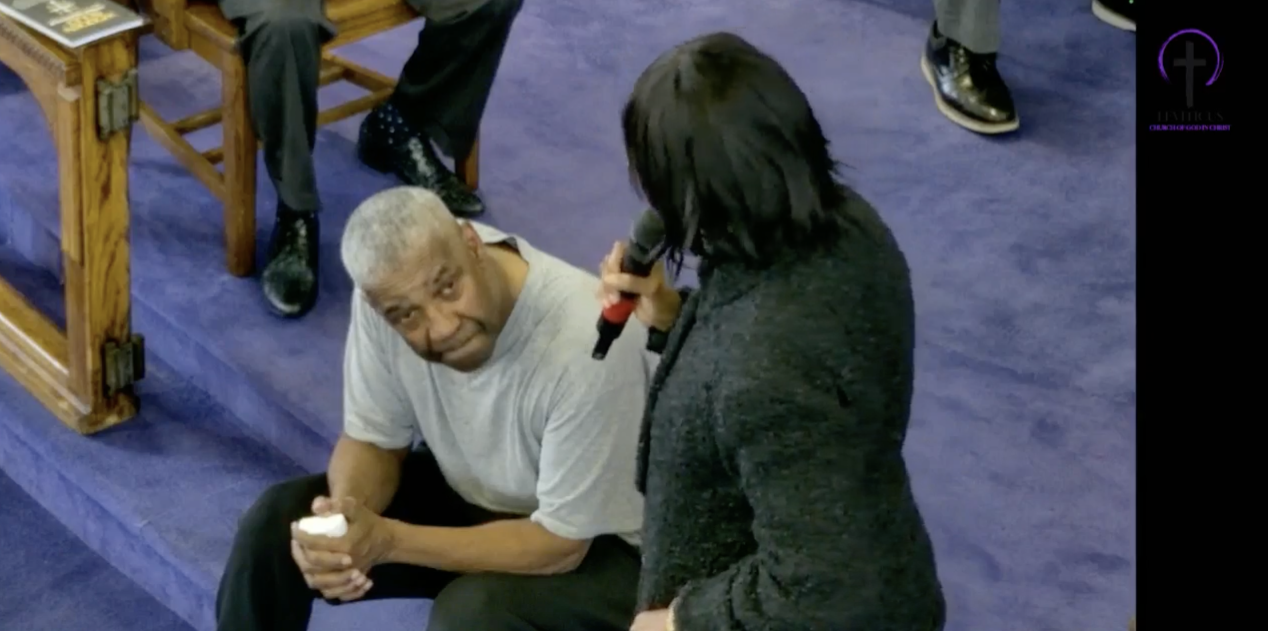 Pauletta Washington speaking to Denzel Washington at his baptism.