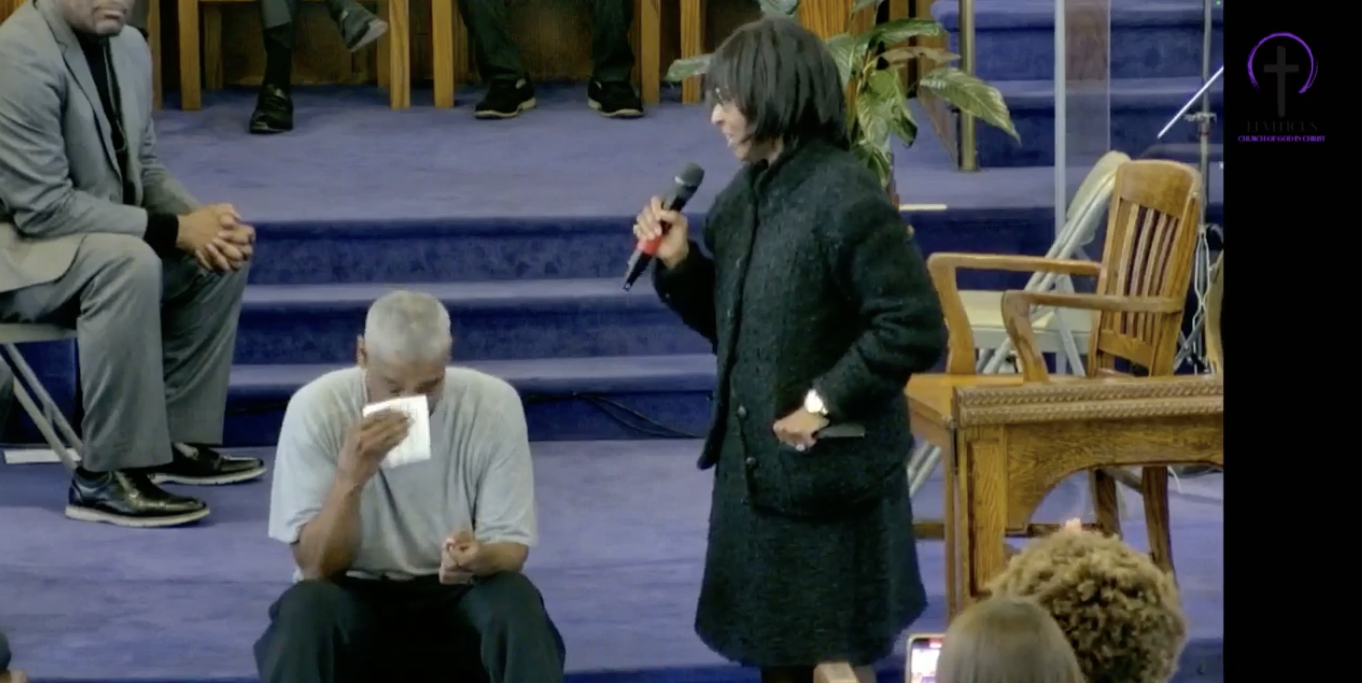 Pauletta Washington speaking to Denzel Washington at his baptism.