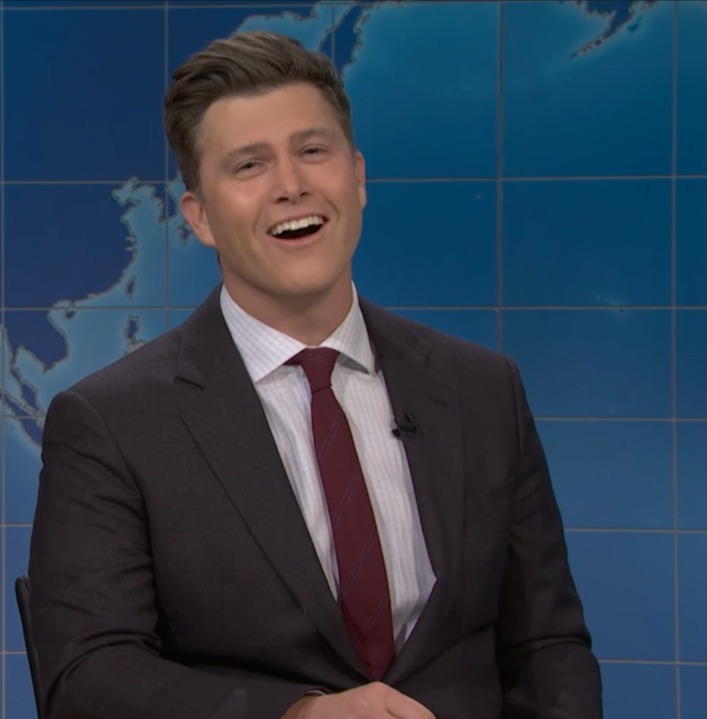 Colin Jost laughing during "SNL" skit.