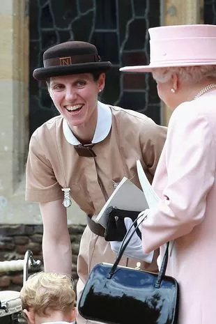 nanny in Norland uniform laughing with the late Queen