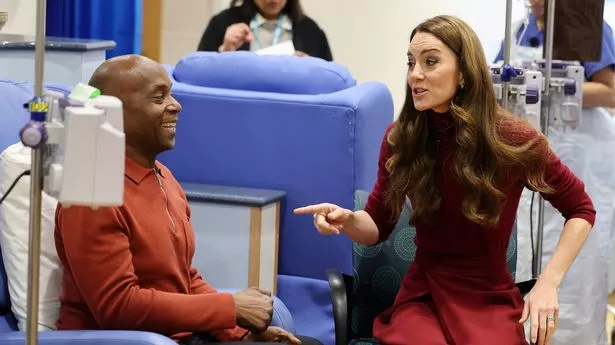 Catherine, Princess of Wales (R) talks with Peter Burton (L), during a visit to The Royal Marsden Hospital on January 14, 2025 in London, England.