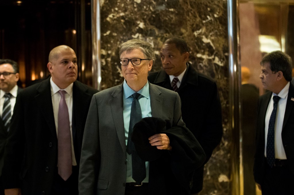 Bill Gates exits an elevator before speaking to reporters at Trump Tower, December 13, 2016 in New York City.