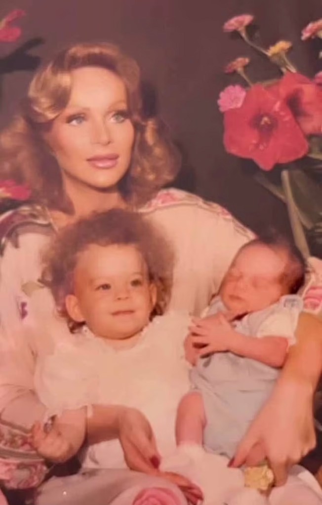 A young Jocelyn Wildenstein holds Diane Wildenstein and Alec Wildenstein Jnr. as toddlers.