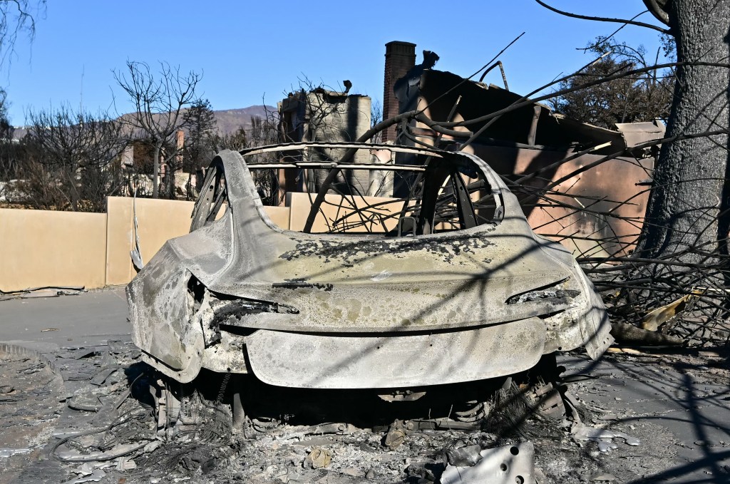 A car burned out by the Palisades Fire is seen in the Pacific Palisades.