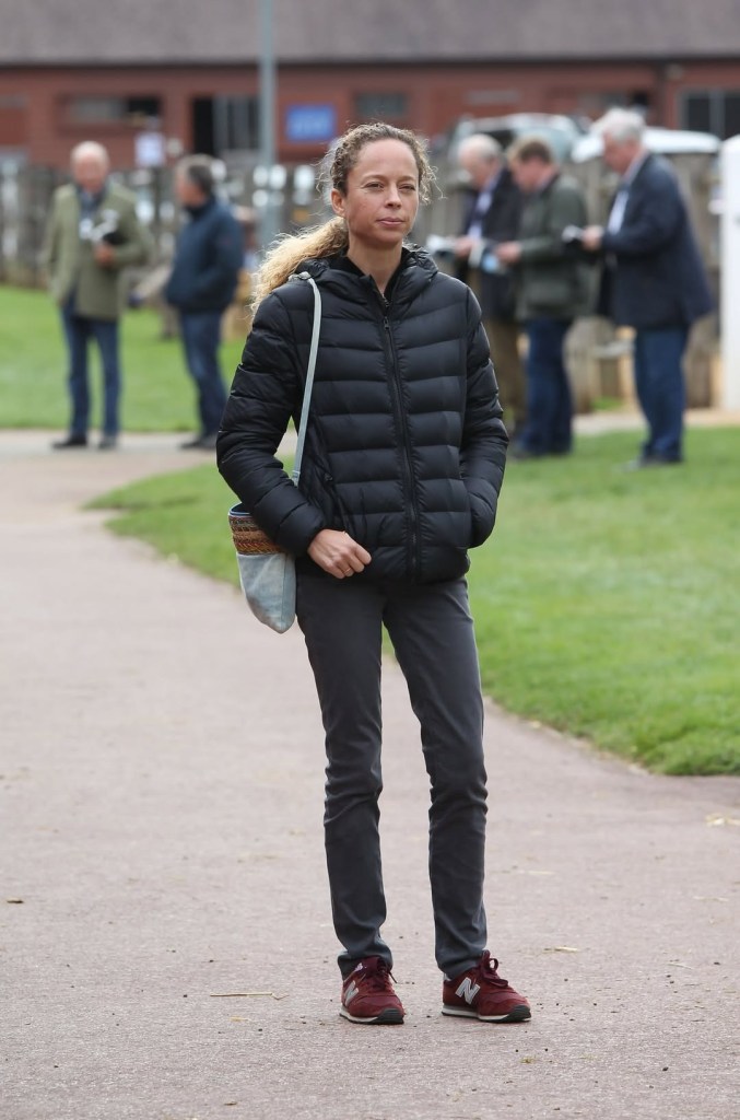 Diane Wildenstein in jeans and a puffer jacket.