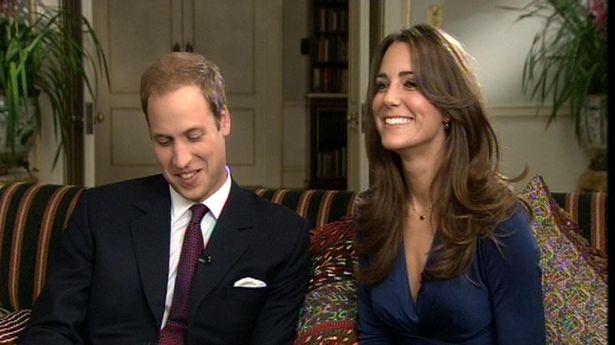 Prince William and Kate Middleton smiling during their engagement interview in November 2010