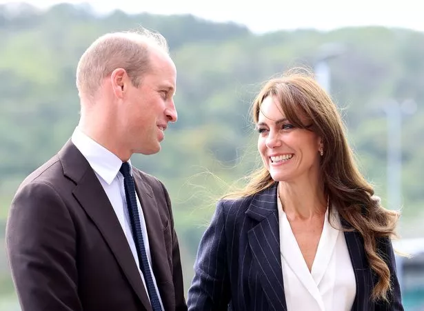 Prince William and Kate Middleton looking at each other and smiling