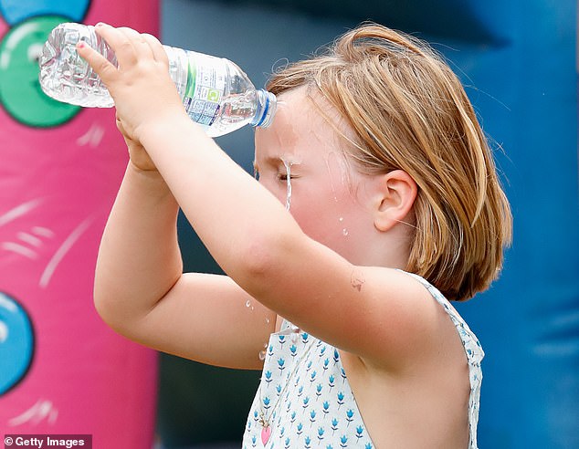 The young royal pouring water on her face at the Festival of British Eventing at Gatcombe Park in 2019