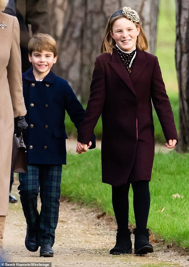 Prince Louis and Mia holding hands as they walk to church for the Christmas Day service in Sandringham in 2023