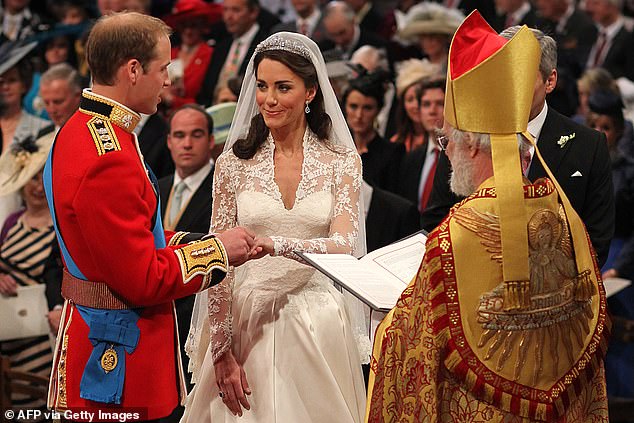 Prince William and Kate Middleton exchange rings in front of the Archbishop of Canterbury during their wedding at Westminster Abbey, on April 29, 2011