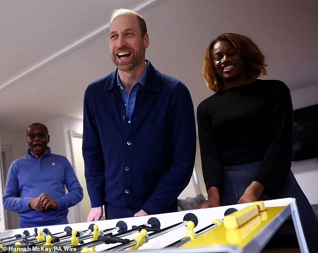 The prince, famously an Aston Villa fan, also played a game of table football while on the charity visit in West London