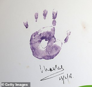 Charles' lilac handprint that he created during a 2018 visit to the children's hospice