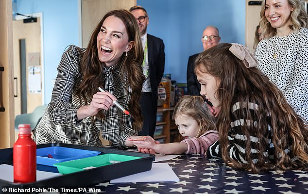 Kate got crafty on the solo visit, helping children with their art by painting their hands and appearing thoroughly in her element