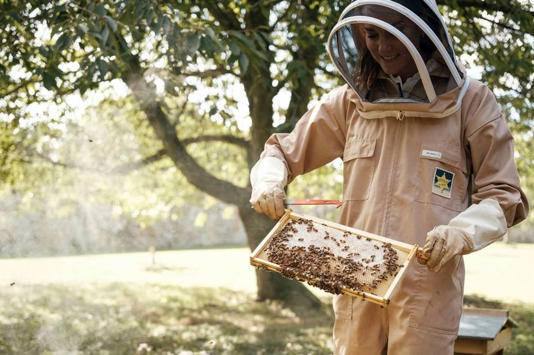 Kate attends to a hive in the gardens at Anmer Hall, on the Sandringham Estate in Norfolk