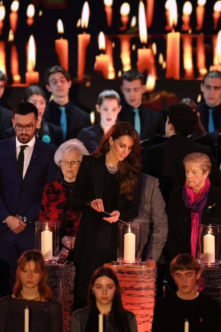 The Princess of Wales lights a candle during a ceremony commemorating Holocaust Memorial Day.