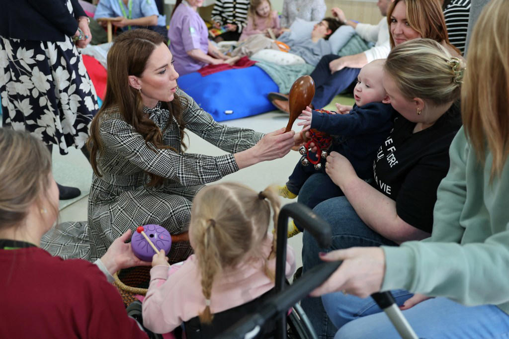 Middleton played instruments with the little ones and chatted with their families. POOL/AFP via Getty Images