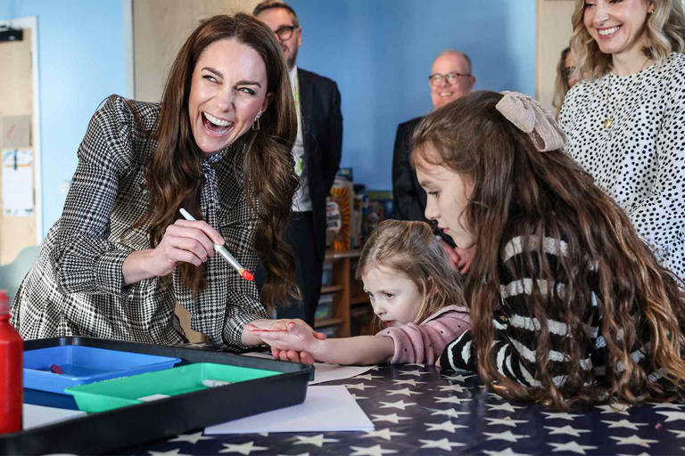 Richard Pohle - WPA Pool/Getty Catherine, Princess of Wales paints the hand of Maggie aged 4 years old whose sibling is being treated at Ty Hafan, a children's hospice based in Sully, near Cardiff. which supports families in Wales to ensure that children with life-shortening conditions live fulfilling lives. The painted hand will be digitised and put on a wall of hand prints inside the hospice, on Jan. 30, 2025 in Sully, Wales