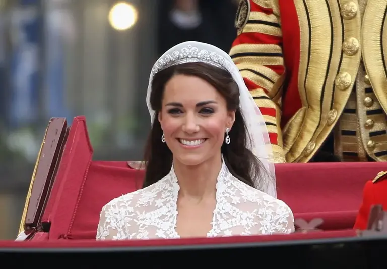 Kate Middleton during the carriage procession on her wedding day wearing the Cartier Halo Tiara | Dan Kitwood/Getty Images