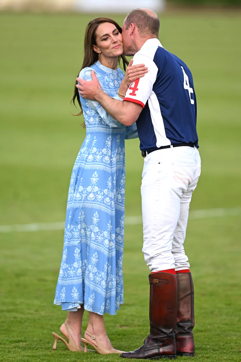 Catherine, Princess of Wales and Prince William, Prince of Wales embrace after the Out-Sourcing Inc. Royal Charity Polo Cup 2023