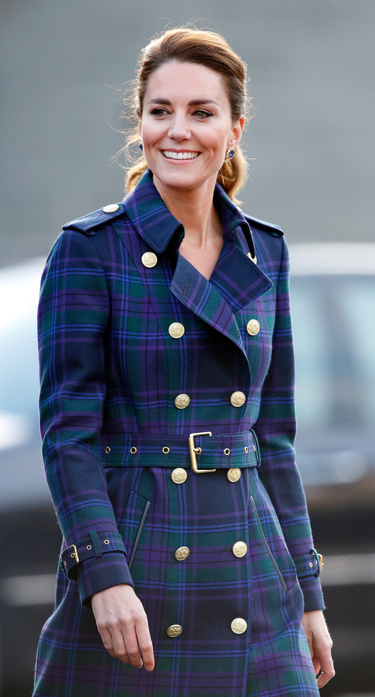 Image may contain Adult Person Face Happy Head Smile Clothing Coat and Tartan