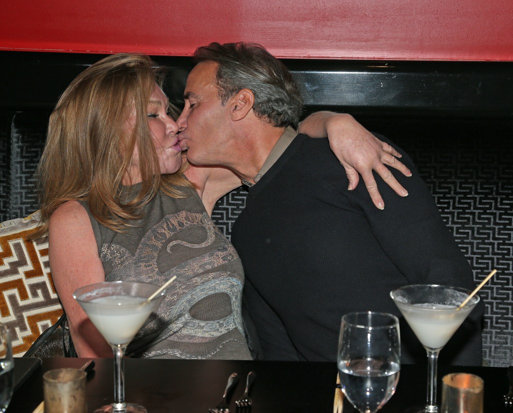 Jocelyn Wildenstein and Lloyd Klein share a kiss at Philippe Chow restaurant.