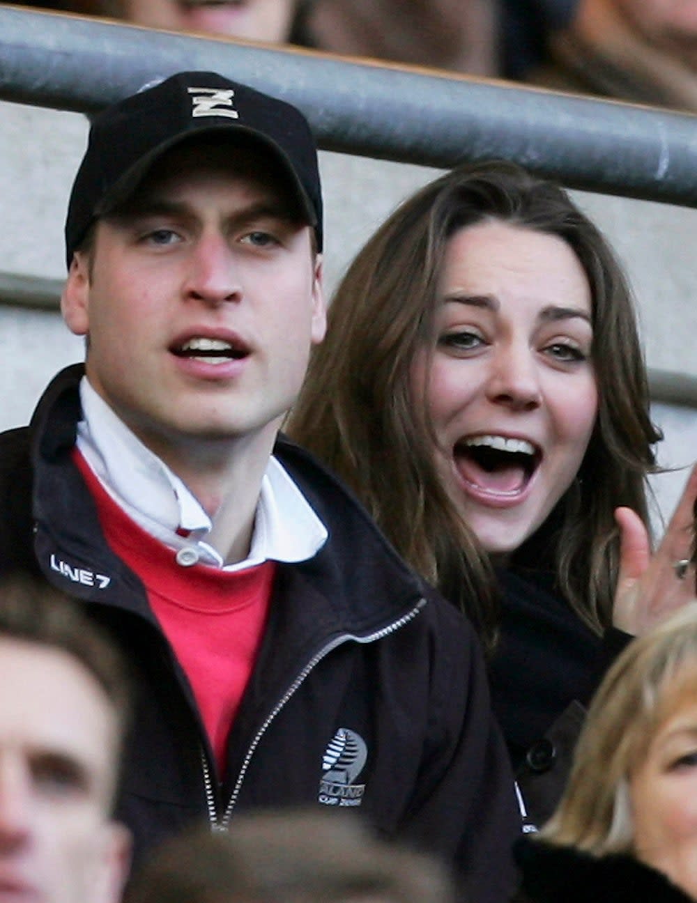 Prince William and Kate Middleton looking surprised at a game.