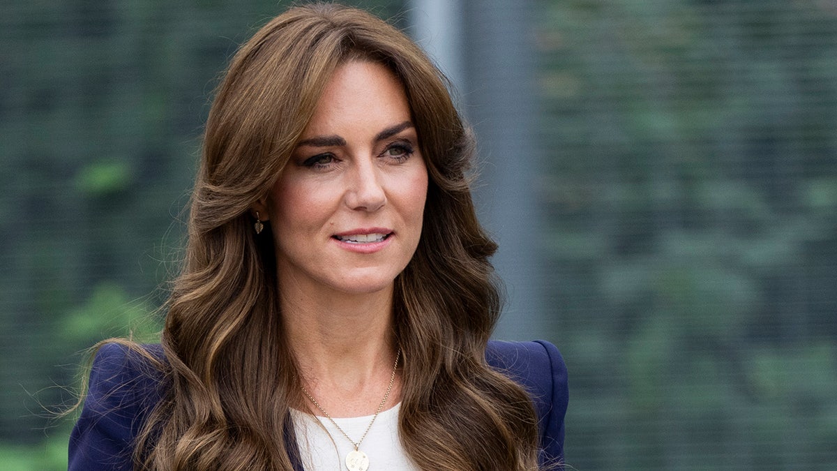 A close-up of Kate Mdidleton wearing a blue blazer and a white shirt.