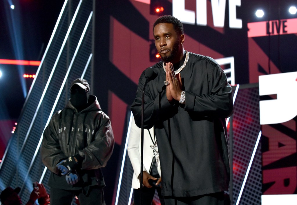 Sean 'Diddy' Combs (R) accepts the Lifetime Achievement Award presented by Coke from Kanye West and Babyface onstage during the 2022 BET Awards at Microsoft Theater on June 26, 2022 in Los Angeles, Calif.