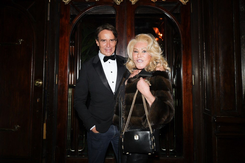 Jocelyn Wildenstein, in a fur coat, with Lloyd Klein, in a tuxedo.