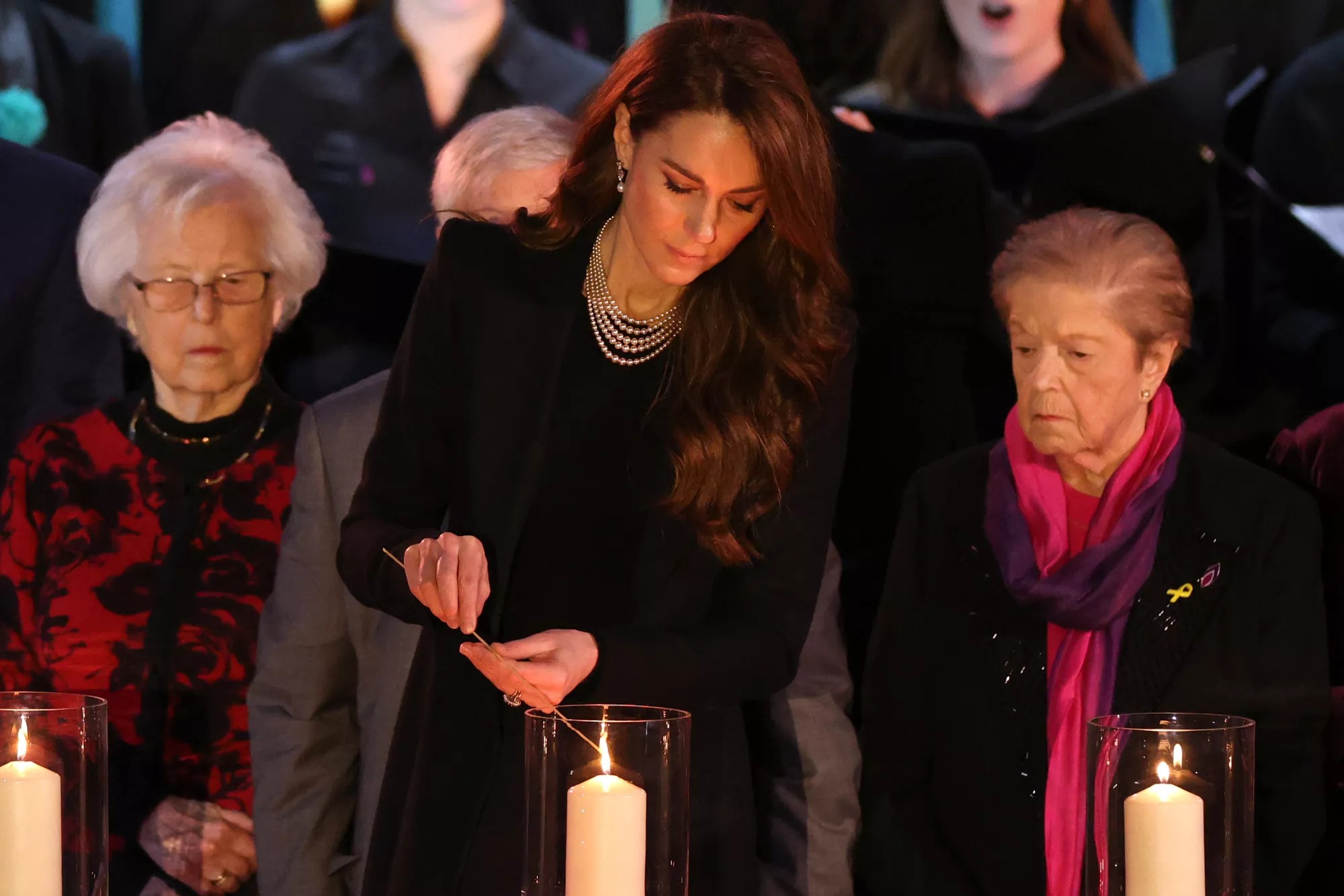 Catherine, Princess of Wales lights a candle during a ceremony commemorating Holocaust Memorial Day on January 27, 2025 in London, England.